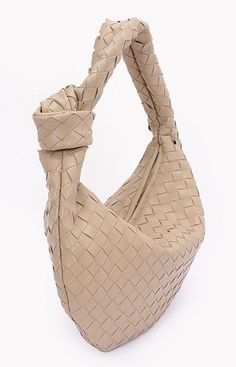 This great bag combines the timeless sophistication of the Bottega Veneta "intreccciato" weave with an everyday price tag. Crafted with meticulous attention to detail from high-quality vegan leather, the Hobo Bag exudes durability and style. Braided handle also echoes the iconic Veneta style. Opens to a single roomy pocket. Available in five stunning colors. Make it your own today  and rock the look of Euro-trashers everywhere! Intrecciato Weave Pouch Shoulder Bag For Errands, Elegant Beige Bucket Bag With Intrecciato Weave, Beige Pouch Shoulder Bag With Intrecciato Weave, Beige Intrecciato Weave Pouch Shoulder Bag, Beige Intrecciato Hobo Bag For Daily Use, Casual Hobo Bag With Intrecciato Weave, Versatile Everyday Hobo Bag With Intrecciato Weave, Beige Pouch Bag With Intrecciato Weave, Casual Hobo Bag With Intrecciato Weave For Shopping