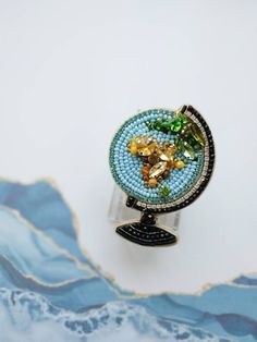 Check out this item in my Etsy shop https://www.etsy.com/listing/1106890991/beaded-globe-brooch-embroidered Bead Brooch, Earth Planet, Moth Art, Brooch Handmade, Embroidered Butterfly, Insect Jewelry, Handmade Gifts For Her, Insect Art, Jewelry Christmas