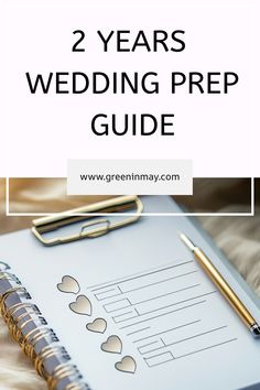 two years wedding prep guide with pen and notebook