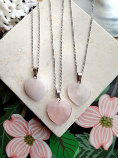 A genuine polished rose quartz heart - shaped crystal is strung on your choice of chain. This healing crystal makes a great gift for all those working on their heart chakra and is a sweet addition to anyones necklace arsenal. Metaphysical Properties:Rose quartz is known as a healing crystal and the stone of unconditional love. It's believed by some to emit strong vibrations of love, which are thought to: support emotional and relationship healing. inspire compassion. boost feelings of peace and Valentine's Day Crystal Necklace With Heart Pendant And Charm, Valentine's Day Heart Pendant Crystal Necklace With Heart Charm, Valentine's Day Heart Charm Crystal Necklaces, Heart-shaped Spiritual Crystal Necklaces For Healing, Heart-shaped Healing Necklaces With Natural Stones, Spiritual Healing Crystal Necklace With Heart Pendant, Spiritual Heart Pendant Crystal Necklace For Healing, Silver Heart-shaped Rose Quartz Jewelry, Spiritual Healing Crystal Heart Necklace