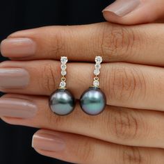 Product Details Grab these captivating piece of earrings set with Round Shape Diamond stones in the bar with Tahitian Pearl stone as Drop. These classic bar drop Earring is composed in Solid Gold, a great gift for your beloved. Product Information SKU SHP-EARRINGS102025958 Weight 1.04 gm (Approximate) TAHITIAN PEARL INFORMATION No.of Stones 2 Pieces Total Weight 16.18 Carat (Approximate) Dimension(approx) Round-8X8 mm-2 Pcs Color Black Cut Brilliant Shape Round Setting Type Bead-Set Quality Grad Classic Bar, Pearl Stone, Diamond Bar, Signature Jewelry, Tahitian Pearls, Timeless Jewelry, Drop Earring, Pearl Drop Earrings, Pearl Drop