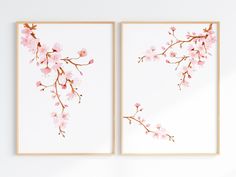 two framed art pieces with pink flowers on them