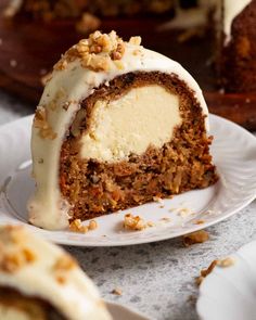 a slice of carrot cake on a white plate