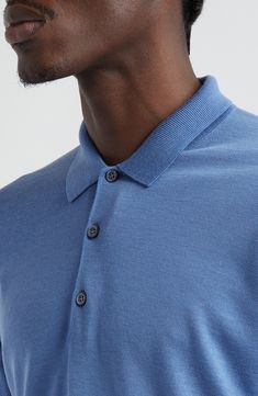 The English label's commitment to understated luxury informs the design of this supremely soft polo sweater crafted from extrafine merino wool. 28" length (size Medium) Button half-placket Spread collar Long sleeves Ribbed cuffs and hem 100% merino wool Dry clean or machine wash, dry flat Made in the UK Blue Wool Collared Top, Classic Blue Cashmere Polo Sweater, Formal Merino Wool Collared Tops, Formal Collared Merino Wool Top, Blue Polo Collar Sweater For Work, Classic Merino Wool Polo Shirt For Work, Blue Merino Wool Polo Sweater With Ribbed Collar, Blue Merino Wool Polo Sweater For Workwear, Casual Blue Merino Wool Polo Sweater