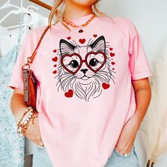 Embrace the Valentine's vibes with our adorable Ragdoll Cat Love Shirt! This heart-filled tee is purr-fect for Ragdoll cat moms and cat aficionados. Flaunt your love for your fluffy friend and spread the joy this Valentine's Day with a shirt that's as cute as it is comfortable. Ideal for a casual date, a day out, or snuggling with your kitty, it's a sweet addition to any cat lover's wardrobe. Gift it to a special someone who cherishes their Ragdoll or treat yourself to this charming expression of cat love. PRODUCT DESCRIPTION: The unisex heavy cotton tee is the basic staple of any wardrobe. It is the foundation upon which casual fashion grows. All it needs is a personalized design to elevate things to profitability. The specially spun fibers provide a smooth surface for premium printing vi Valentines Day Cat, Valentines For Mom, Cat Mom Gifts, Valentine Shirt, Cat Valentine, Cat Tee, Ragdoll Cat, Casual Date, Valentines Shirt