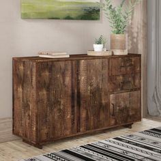 a large wooden cabinet sitting on top of a hard wood floor next to a window