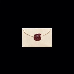 an envelope with a wax seal on it