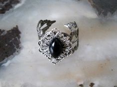 This beautiful sterling silver plated filigree ring has a sterling silver plated filigree setting with black obsidian stone. Adjustable. Gothic Silver Crystal Promise Ring, Silver Gothic Crystal Promise Ring, Gothic Silver Crystal Ring With Gemstone, Gothic Silver Filigree Ring For Gifts, Gothic Silver Rings With Intricate Design, Gothic Silver Rings For Gifting, Gothic Silver Rings For Gifts, Gothic Silver Ring As A Gift, Silver Gothic Rings For Gifts