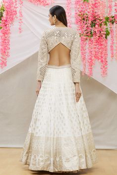 Ivory gown with zardozi, floral, mirror work and side cut-out detailing.
Component: 1
Pattern: Embroidery
Type Of Work: Zardozi, floral, mirror
Neckline: Round
Sleeve Type: Full sleeves
Fabric: Banarasi silk
Color: White
Other Details: 
Back and side cut-out
Occasion: Reception - Aza Fashions Embroidered Embellished Dress For Wedding And Diwali, Embroidered Dress For Wedding Diwali, White Embroidered Dress With Zari Work For Wedding, Elegant Embroidered Dress For Diwali Reception, Embroidered Embellished Dress For Wedding, Bollywood Style Embroidered Maxi Dress For Reception, Bollywood Style Embroidered Dress For Diwali Reception, Bollywood Embroidered Dress For Diwali Reception, Intricate Embroidered Dress For Diwali Reception