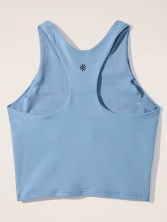 FOR: School, practice, and play FEEL: Powervita fabric is buttery soft with support that feels like a gentle hug FAVE: High-neck racerback for coverage and comfort Fitted next to the body. Racerback Tops With Built-in Bra For Light Sports, Fitted Racerback Tank Top For Light Sports, High Stretch Racerback Tank Top For Training, Solid Seamless Tank Top For Training, High Stretch Racerback Tank Top For Light Sports, High Stretch Racerback Activewear For Spring, Compressive Racerback Tank Top With Mesh Back, Supportive Racerback Top With Built-in Bra, Compressive Scoop Neck Top For Training