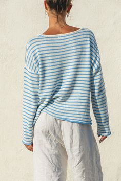 Meet our Morning Sea Striped Pullover Sweater. This season's must-have, with a sky blue and white horizontal stripe, boat neckline, and easy oversized fit. This will be the perfect sweater to wear as we ease into a new season. Casual Striped Sweater For Day Out, Spring Striped Relaxed Fit Sweater, Spring Contrast Stripes Relaxed Sweater, Spring Contrast Stripes Relaxed Fit Sweater, Striped Relaxed Fit Sweater For Spring, Spring Relaxed Fit Contrast Stripes Sweater, Spring Relaxed Fit Sweater With Contrast Stripes, Relaxed Fit Striped Spring Sweater, Relaxed Fit Sweater With Contrast Stripes For Spring