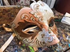 "Original Venetian Colombina mask, hand painted embellished with Glitter, decoration with stucco and acrylic colors. -Material/Resin Made in Italy hypoallergenic and non-toxic. -Dimensions/16x8 Unisex -History of the mask/ \"Colombina\" is an ancient mask dating back to the 15th century. She represents a cunning and lying servant at the court of often very rich men such as the greedy and rich Venetian merchant \"Pantalone\" of Carlo Goldoni's commedia dell'arte. -Shipping/worldwide We ask you to White Masquerade Mask For Carnival Festivals, Traditional White Masquerade Mask For Carnival, Venetian Multicolor Party Masks, Traditional Masquerade Mask For Carnival, Multicolor Venetian Masks For Party, Venetian Festival Eye Mask, Hand Painted Masks For Masquerade Carnival, Multicolor Venetian Party Masks, Hand Painted Masks For Carnival Masquerade