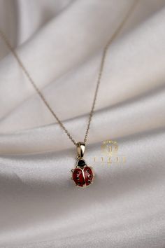 "ABOUT PRODUCT This 14K Gold  Ladybug necklace is beautifully designed and hand crafted with our associates to make this a special gift for your loved ones. Knowing the value of our customers, We prepare each piece with extra care and attention. ITEM DETAILS Material: 14K Gold Approx: 2.20 gr  Only Pendant: 1.30 gr Available colors: Gold, Rose Gold, White Gold Available Sizes: 14\" to 20\" ✪ 14k Solid Gold ( Certification will be included with your order ) ✪Available 14K White, Yellow, Rose Gold Dainty Oval Charm Necklaces, Dainty Oval Charms Necklaces, Dainty Oval Necklaces With Charms, Minimalist Oval Pendant Jewelry For Gifts, Minimalist Oval Pendant Jewelry Gift, 14k Gold Oval Pendant Charm Necklace For Gift, Oval Pendant Jewelry With Adjustable Chain For Gift, 14k Gold Charm Necklace With Lobster Clasp, 14k Gold Charm Necklace With Lobster Clasp For Gifts