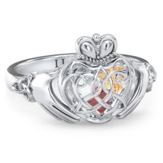 A symbol of loyalty, friendship, and love, this Claddagh design features a Celtic-inspired caged heart. The three-dimensional cage holds 2 or 3 loose heart-shaped birthstones sealed inside to represent your loved ones. Design yours in sterling silver, white, yellow, or rose gold with a choice of gemstones and personalize with a unique ring base engraving for the perfect gift for someone special. Celtic Claddagh Ring, Knot Rings, Ring With Gemstone, Silver Claddagh Ring, Mothers Ring, Claddagh Ring, Celtic Knot Ring, Claddagh Rings, Celtic Rings