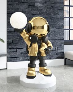 a statue of an astronaut holding a white ball