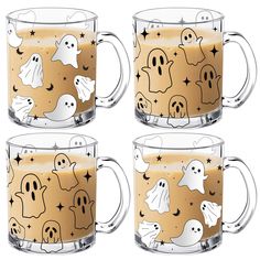 three halloween mugs with ghost faces and stars are shown in front of each other