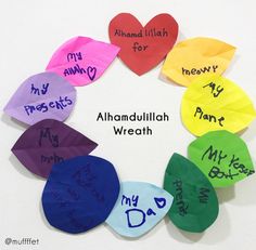 colorful paper hearts with words written on them in different languages, arranged in a circle