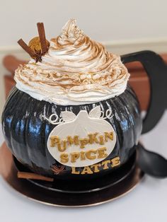 a pumpkin spice latte sitting on top of a plate