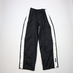 Vintage 90s Nike Mens XL Mini Swoosh Wide Leg Tearaway Pants Black Mens Pants Blemishes on white stripes Mens size XLarge Measurements are: 14.5 inches across the waist laid flat 33 inch inseam 44 inches from top to bottom 10.5 inch leg open Black Polyester US Shipping is FREE, Canada is $15 and International is $24 Check out my other items in my store! PR863 Nike Y2k Pants, Tearaway Pants, Nike Hose, Y2k Pants, Black Pants Men, 90s Nike, Nike Vintage, Pants Vintage, Nike Mens