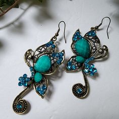 Beautiful Butterfly Earrings Turquoise Blue In Color Set In Antique Goldtone Alloy Hook Style New #31 Boho Bohemian Hippie Gypsy Casual Dressy Wedding Event Work Summer Fairycore Blue Bohemian Crystal Earrings, Bohemian Blue Crystal Earrings, Blue Metal Crystal Earrings, Blue Crystal Metal Earrings For Pierced Ears, Blue Bohemian Crystal Drop Earrings, Bohemian Blue Crystal Drop Earrings, Summer Fairycore, Butterfly Dangle Earrings, Rose Gold Drop Earrings