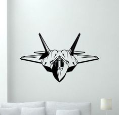 a black and white wall decal with an image of a fighter jet on it