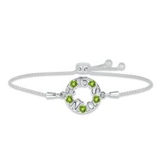 Make her Quinceañera dreams come true with this lovely bolo bracelet, perfect for celebrating an August birthday. The phrase "15 Años" is crafted in sterling silver with colorful round peridots gleaming between the letters. The wheat chain measures up to 9.5 inches and secures with an adjustable bolo clasp. Anniversary Birthstone Name Bracelet, Sterling Silver Bracelets For May Birthstone Anniversary, Silver Bracelet For Anniversary With May Birthstone, Sterling Silver Jubilee Bracelet Jewelry For Birthday, Adjustable Silver Name Bracelet With Birthstone, Anniversary Bracelet With Adjustable Chain, Adjustable Sterling Silver Name Bracelet For Anniversary, Jubilee Bracelet Jewelry For Anniversary With May Birthstone, Anniversary Green Sterling Silver Bracelets