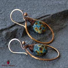 Fabulous and fun Turquoise Drops Earrings!  Gorgeous one-of-a-kind art for your ears made with artisan lampwork glass headpins and artisan antique brass finish wire rings, artisan antique brass finish ear wires.   Brimming with beauty and whimsy, truly a party for your eyes!  This is the only pair of earrings like this!  Rock your earlobes with these lovelies.  Express yourself with art you can wear!  These unique earrings are versatile, making them a must-have accessory.   Materials for Turquoi Artsy Blue Metal Jewelry, Artisan Teardrop Earrings With Artistic Design, Handmade Teardrop Glass Jewelry, Adjustable Drop Earrings With Artistic Design, Artistic Wire Wrapped Drop Earrings, Artsy Copper Drop Earrings, Handmade Artsy Metal Jewelry, Adjustable Teardrop Artsy Earrings, Nickel-free Teardrop Artsy Earrings