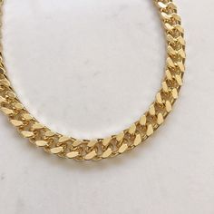 "Elevate the every day with this beautiful Statement thick gold chain necklace . Classic and super trendy for layering and for everyday wear. Materials: 14k gold plating over brass. Nickel free. Measurements: Chain length: 40cm (15\") +8cm(3\") extender chain. Chain thickness: 8 mm Shipping: Please allow 1-3 business days for your order to be processed and shipped. Gift: All orders are shipped in our customize box, gift ready. **Let me know if you have any questions at all and I will promptly re Gold Cuban Link Double Chain Necklace, Trendy Gold Cuban Link Necklaces, Trendy Gold Cuban Link Necklace, Trendy Gold Plated Chain Link Necklace, Trendy Gold Curb Chain Necklace, Trendy Gold Cuban Link Chain Necklace, Gold-tone Chunky Necklace As Gift, Trendy Cuban Link Gold Chain Necklace, Chunky Gold-tone Necklace For Gift