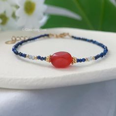 Lapis Lazuli and Red Agate Minimalist Bracelet, Natural Stone Dainty Bracelet, Healing Crystal Protection December Birthstone Gift ◽️ S I Z E ∙ G U I D E ◽️   All bracelets in shop are adjustable, which can fit for most wrist size. ◽️ P A C K A G I N G ∙ R E C E I P T S ◽️  * All items are nicely packaged ready to gift in elegant jewelry boxes. * As so many of our orders are gifts, I do not include receipts in any of our packaging. Receipts can be found under your purchases on Etsy. ◽️ U P G R A D E ∙ P A C K A G I N G ◽️  * Our default packaging is gift-ready. You can also upgrade it to premium gift wrapping by clicking 「 Mark order as a gift 」 when check out. ◽️ T U R N ∙ A R O U N D ∙ T I M E ◽️   * All items purchased will be shipped within 5 business days. ◽️ D O M E S T I C ∙ S H I P Adjustable Carnelian Gemstone Beaded Bracelet, Red Carnelian Gemstone Bracelets, Red Gemstone Dainty Bracelets, Red Gemstone Dainty Bracelet, Blue Carnelian Jewelry For Gift, Blue Carnelian Jewelry As A Gift, Blue Carnelian Jewelry Gift, Blue Carnelian Jewelry For Gifting, Crystal Protection