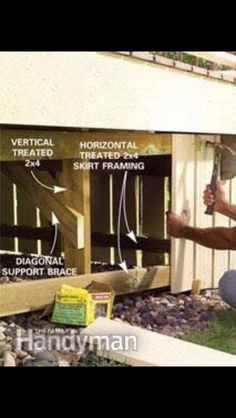 a man kneeling down in front of a house with siding on the walls and insulation