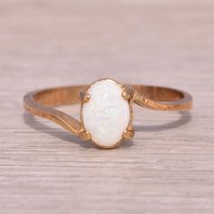 This Stunning Piece, Known As The Italian Opal, Features An Enchanting Oval-Shaped Australian Opal That Shimmers With A Mesmerizing Play Of Colors. The Opal Is Elegantly Set In Warm Yellow Gold, Enhancing The Opal’s Natural Beauty With A Classic And Refined Design. This Ring, Crafted With Precision In Italy, Exemplifies Both Craftsmanship And Timeless Elegance. The Ring Is Crafted In Yellow Gold And Is Currently A Finger Size 6 Yet Can Be Adjusted To Any Finger Size For An Additional Charge Upon Request, Ensuring A Perfect Fit. Opal Gold Ring, Australian Opal Ring, Yellow Gold Color, Opal Ring Gold, Warm Yellow, Opal Ring, Australian Opal, Opal Rings, Womens Jewelry Rings