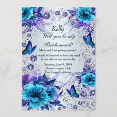 an elegant wedding card with blue flowers and butterflies on the front, in silver foil