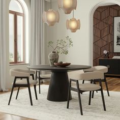 a dining room table with four chairs around it