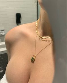 a close up of a woman's breast in a bathroom