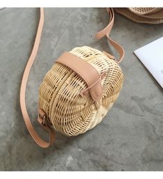 This Elena Handbags handmade rattan shoulder bag with leather straps is carefully crafted with inner lining perfect for your next beach vacation. Size: 17cm (6.7in) diameter 7cm (2.75in) thick Designer Style ID: 8210 Elena Handbags Handmade Rattan Woven Shoulder Purse with Leather Straps Trendy Natural Shoulder Bag For Picnic, Light Brown Straw Bag With Adjustable Strap For Beach, Light Brown Crossbody Straw Bag For Vacation, Light Brown Straw Beach Bag With Adjustable Strap, Natural Rattan Straw Bag With Adjustable Strap, Light Brown Satchel Straw Bag For Beach, Natural Straw Crossbody Bag With Bamboo Handle, Summer Crossbody Straw Bag With Woven Leather, Travel Shoulder Bag With Bamboo Handle In Rattan