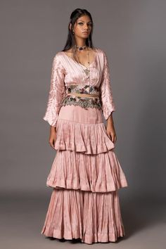 Pink tiered lehenga in a pleated ruffle base on a tiered silhouette. Comes with pleated ruched blouse highlighted by french knot embroidery on waistband. Paired with embroidered belt. - Aza Fashions Elegant Wedding Choli With Tiered Skirt, Elegant Festive Choli With Tiered Skirt, Elegant Tiered Skirt Sharara For Wedding, Elegant Tiered Sharara For Wedding, Elegant Festive Sets With Tiered Skirt, Elegant Festive Set With Tiered Skirt, Silk Floor-length Lehenga With Ruffles, Designer Anarkali Dress With Tiered Skirt, Traditional Anarkali Set With Tiered Skirt For Wedding