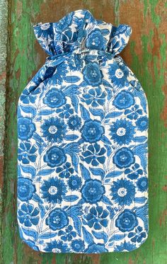 Blue Sunflower Quilted Hot Water Bottle Cover. Hand block printed on certified organic cotton. Super soft, cosy and practical. Drawstring top. Approx 7.5 inches wide x 14 inches long (including above the drawstring).  Our tiny workshop in Rajasthan, India has been producing duvet covers, pillowcases, tablecloths, nightwear, wash bags and hankies for us for over 25 years. Ten years ago we started searching out organically grown cotton and now everything we make is made from certified organic cotton. Quilted Hot Water Bottle Cover, Tiny Workshop, Blue Sunflower, Sunflower Quilts, Water Bottle Covers, Hot Water Bottle Cover, Drawstring Top, Hot Water Bottle, Bottle Cover