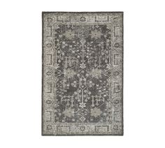 a gray and white rug with an ornate design on the bottom, in front of a white background