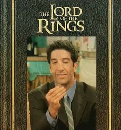 the lord of the rings is holding his finger up in front of him, while wearing a suit and tie