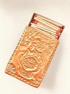 an open matchbox with matches in it