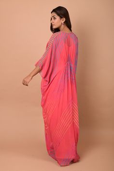 Pale pink kaftan tunic with all-over multicolored print, embroidered V-neckline and asymmetric hem.
Component: 1
Printed, Embroidered
Neckline: V-Neck
Sleeve Length: Three Quarter
Fabric: Georgette
Color: Pink
Embroidery at the sleeves and waist
Gathers at the back
Asymmetric hem
Note: The inner slip worn by the model is not for sale - Aza Fashions Designer V-neck Summer Dresses, Summer Designer V-neck Dresses, Designer Summer V-neck Dress, Pink Floor-length Kaftan For Festive Occasions, Bohemian Designer Kaftan For Summer, Pink Kaftan For Festivals, Bollywood Style Pink Saree Kaftan, Bohemian Designer Summer Kaftan, Pink Floor-length Festive Kaftan