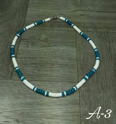 "Turquoise Puka Shell Necklace This Necklace is Unisex Is Handmade with seashells Fits Most Size - 17.5\" inches long FAST SHIPPING! Visit my Etsy Shop to see more Designs! Handmade Puka Necklaces, Bracelets and Earrings: https://www.etsy.com/shop/FreedomLifeStyle" Turquoise Strand Jewelry With Ocean-inspired Style, Blue Strand Necklace With Ocean-inspired Style, Turquoise Strand Jewelry In Ocean-inspired Style, Turquoise Strand Jewelry Ocean-inspired, Ocean-inspired Turquoise Strand Jewelry, Blue Ocean-inspired Strand Necklace, Handmade Blue Necklaces For Beach, Turquoise Ocean-inspired Necklaces For Jewelry Making, Handmade Blue Necklaces For The Beach