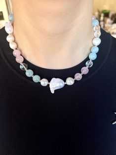 This delicate necklace is crafted with aquamarine, rose quartz, and clear quartz beads, beautifully complemented by lustrous freshwater pearls and two stunning Baroque pearls. The platinum-plated copper spacer beads and a unique rose flower clasp add an elegant touch to the design. * Aquamarine: Known for its calming energy, aquamarine helps reduce stress and promotes clear communication. * Rose Quartz: The stone of love, rose quartz encourages compassion, self-love, and emotional healing. * Cle Rose Quartz Gemstone Beaded Necklace, Adjustable Rose Quartz Gemstone Necklace, Rose Quartz Faceted Beads Necklace Gift, Rose Quartz Necklace With Faceted Round Beads, Clear Quartz Necklace, Hand-strung Pink Rose Quartz Necklace, Unique Roses, Jewelry For Her, Quartz Necklace