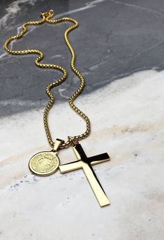 "《《 SPIRITUAL COLLECTION 》》 THE DETAILS The \"GOLD SAINTS CROSS\" is designed with an ultra shiny Gold Stainless Steel Cross Pendant, layered with an incredibly detailed Gold Stainless Steel Reversible Coin Pendant, engraved on one side with the Saint's Cross, and on the other side with the Saint Benedict Crest, both hung from a Gold Stainless Steel Box Chain available in your choice of length! 💠🔷️💠View entire SPIRITUAL COLLECTION here: https://www.etsy.com/shop/mrmackjewelry/?section_id=2704 Gold Crucifix Jewelry For Commemoration, Gold Jewelry With Polished Finish For Father's Day, Gold Cross Jewelry With Coin Pendant, Classic Gold Necklaces For Father's Day, Gold Cross Necklace For Father's Day, Necklace Length Chart, Stainless Steel Cross Pendant, Mens Gold Jewelry, Box Chain Necklace