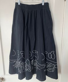 A beautiful vintage black skirt with white embroidery of artist Pablo Picasso's Bacchanalia 1959 work. This is a rare piece and a unique statement for a lover of art or Picasso. It is a size Large and has elastic in the waist. It measures 31 inches long or just past the knee on most people. It's a chic length for flats, heel or tennis shoe. It is more vibrant (a deeper black) than the photos articulate and is in very good condition. Black Cotton Skirt With Floral Embroidery, Traditional Black Cotton Skirt, 90s Ralph Lauren, Puffed Heart, Fair Isle Sweater, White Embroidery, Black Skirt, Fair Isle, Vintage Black