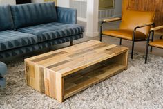 a living room with two couches and a coffee table in front of the couch