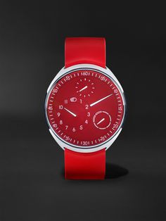 Ressence has a "less is more" philosophy but it can still make a statement, as this limited-edition 'Type 1 Slim' watch shows. Rendered almost entirely in red, it represents a departure from the house's signature colour palette, inspired by a one-of-a-kind timepiece created in 2020. Like other iterations of the model, this one has a titanium case and runs on an Orbital Convex System that's driven by the minute axle of an automatic movement to display the time and day in a unique way. The rubber Classic Red Analog Watch, Red Classic Analog Chronograph Watch, Classic Red Analog Chronograph Watch, Classic Red Chronograph Analog Watch, Red Chronograph Watch With Subdials, Red Chronograph Watch With Analog Display, Formal Red Chronograph Watch With Analog Display, Classic Red Chronograph Watch, Red Watches With Subdials And Round Dial