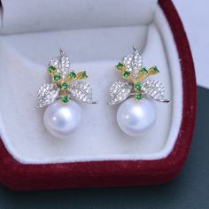 Our 11-12mm Freshwater Pearl & Color Floral Earrings are the perfect way to show off your unique style. The glimmering pearls and vibrant flower design will instantly add charm to any look. Exuding elegance, these earrings are perfect for any occasion, formal or casual. Crafted by House of Pearls, these earrings are sure to become your favorite go-to accessory. Make a timeless statement with every wear and step out with confidence! Pearl size:Earrings: 11-12mm This popular earrings design featur Luxury White Cubic Zirconia Flower Earrings, Silver Pearl Drop Flower-shaped Earrings, White Pearl Earrings In Flower Shape For Formal Events, White Pearl Flower Earrings For Formal Occasion, White Flower-shaped Pearl Earrings For Formal Events, White Floral Pearl Earrings For Formal Occasions, White Floral Pearl Earrings For Formal Events, Formal Pearl White Flower Drop Earrings, Formal White Flower-shaped Pearl Earrings