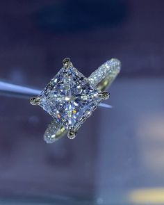 a fancy diamond ring is shown on display