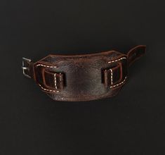 -Dark brown Bund strap of High quality. Leather watch band in Aviator style is unique, no two straps are the same. Compatible with watch case 18 mm, 20 mm, 22 mm, 24mm. Leather cuff watch strap is soft, comfortable, durable and fits perfectly on the wrist, enhances the beauty of your watch. Made of best english distressed leather. Will appeal to connoisseurs of vintage style. Swap bands to suit an occasion or to give your watch a new look. Custom handmade watch band is a good and thoughtful gift for your dear person, which will remind you of you for a long time. -Military Aviator strap Design, designed and made by me from start to finish. I wanted the strap to be durable and comfortable so I chose distressed leather Crazy Cow. Leather from the legendary English manufacturer Charles F Stead Handmade Watch Bands, Handmade Watch, Leather Watch Band, Cuff Watch, Aviator Style, Leather Watch Strap, Leather Watch Bands, Leather Cuffs, Distressed Leather